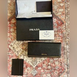 Prada Black Saffiano Leather Flap Wallet With Metal Bar Detail 1MH132 Nero